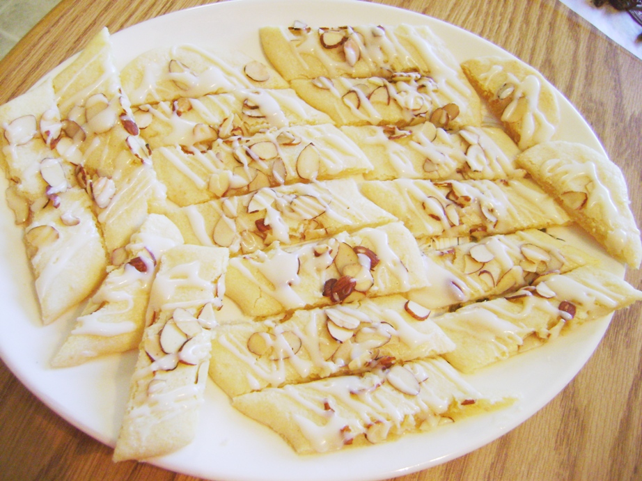 Almond Strips - OMG these are the best...almond flavored shortbread drizzled with almonds and vanilla flavored icing